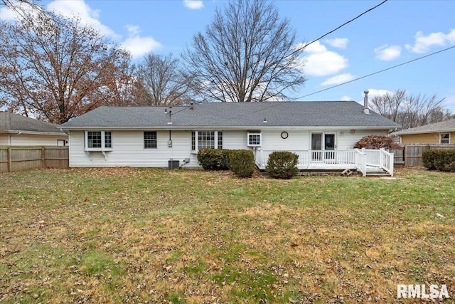 back of property featuring central AC, a yard, and a deck