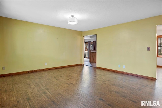 unfurnished room featuring wood-type flooring