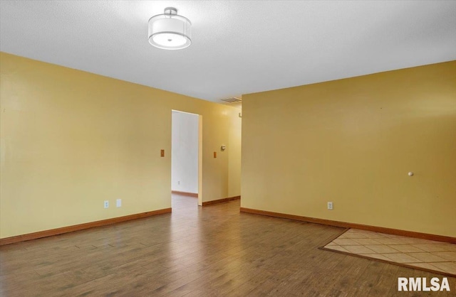 empty room with wood-type flooring