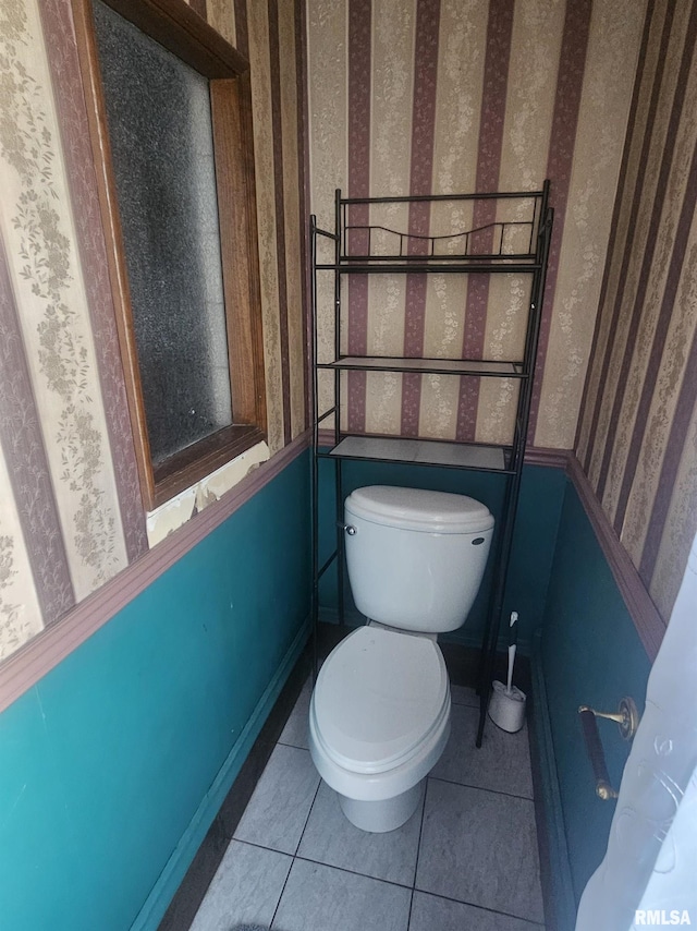 bathroom featuring tile patterned flooring and toilet