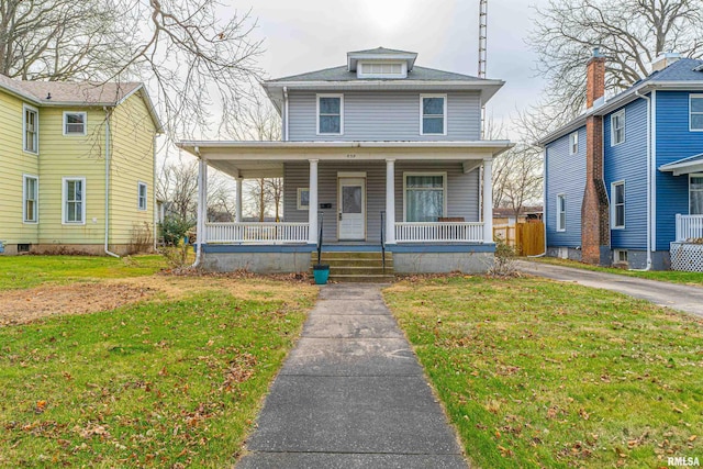 view of front facade featuring a porch and a front yard