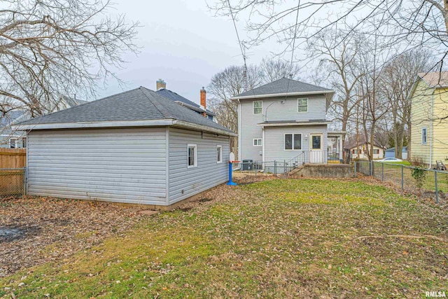 back of house with a yard