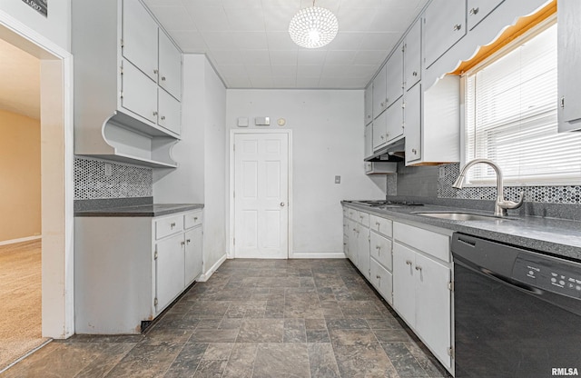 kitchen with tasteful backsplash, dark carpet, stainless steel gas cooktop, sink, and dishwasher