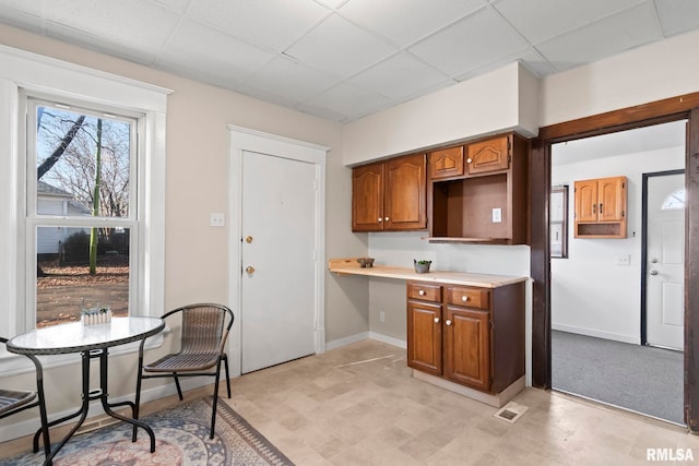 kitchen featuring a drop ceiling