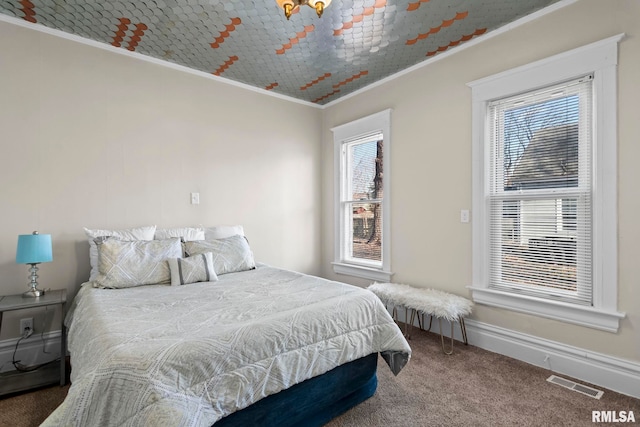 bedroom with carpet floors and ornamental molding