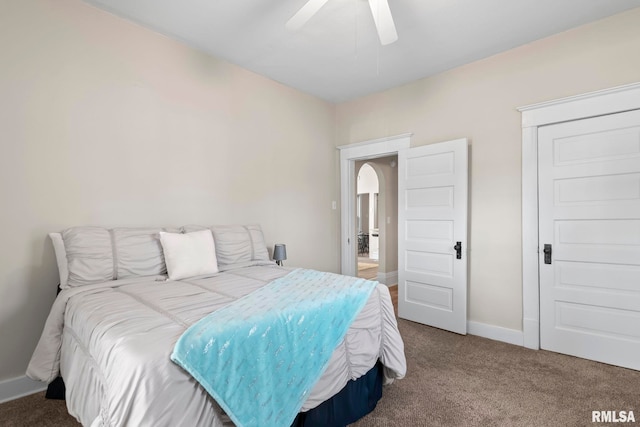 carpeted bedroom featuring ceiling fan