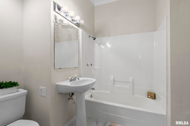 bathroom with shower / washtub combination and toilet