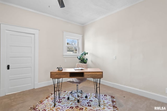 carpeted office space with ceiling fan and crown molding