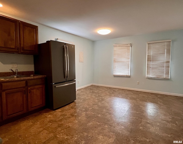 kitchen with stainless steel fridge and sink