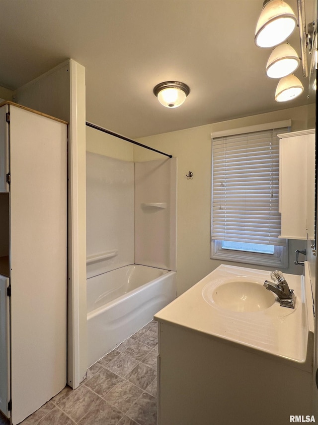 bathroom with shower / tub combination and vanity