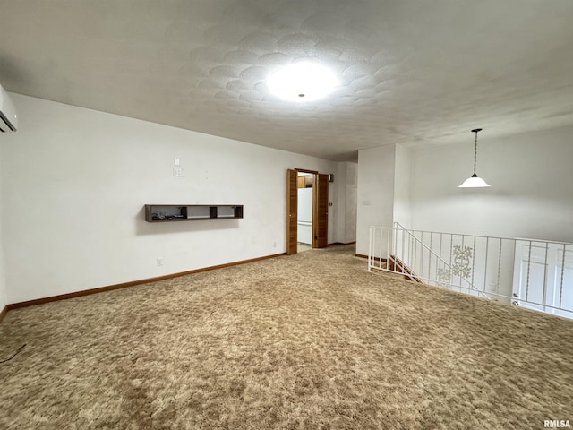 spare room with carpet and a textured ceiling