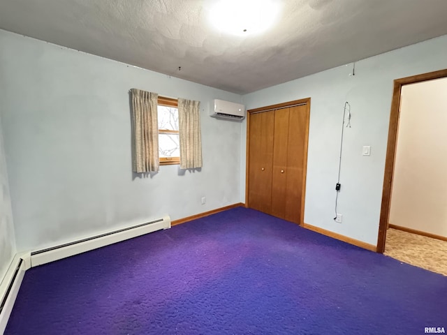 unfurnished bedroom featuring carpet, a closet, a baseboard heating unit, and a wall mounted AC