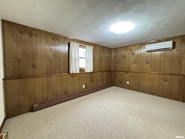 basement featuring a wall mounted air conditioner, wooden walls, a baseboard heating unit, and carpet flooring