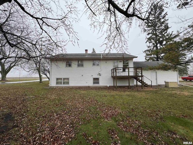 rear view of house with a yard