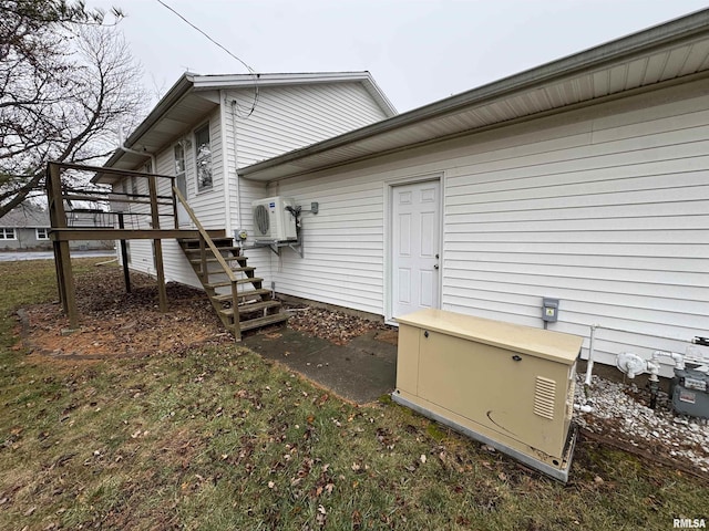 view of side of property featuring ac unit