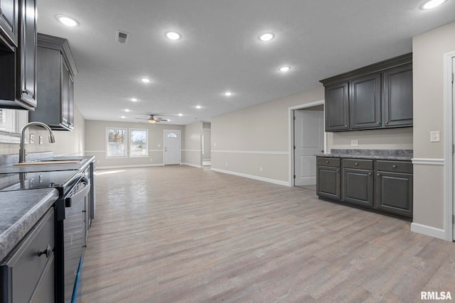 kitchen featuring electric stove, ceiling fan, sink, and light hardwood / wood-style floors