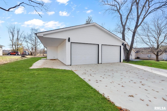 garage featuring a lawn