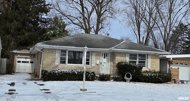 view of front of property with stone siding and an attached garage