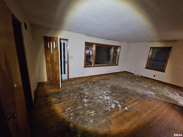 unfurnished room featuring a textured ceiling