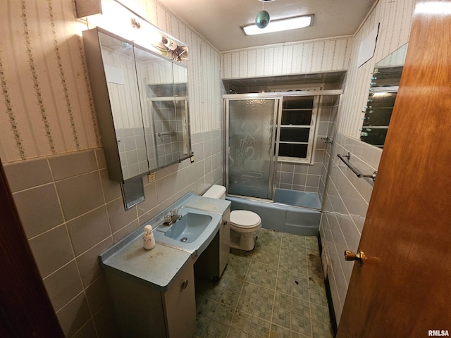 full bathroom with vanity, toilet, and enclosed tub / shower combo