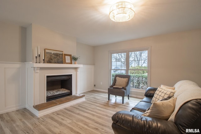 living room with light hardwood / wood-style flooring