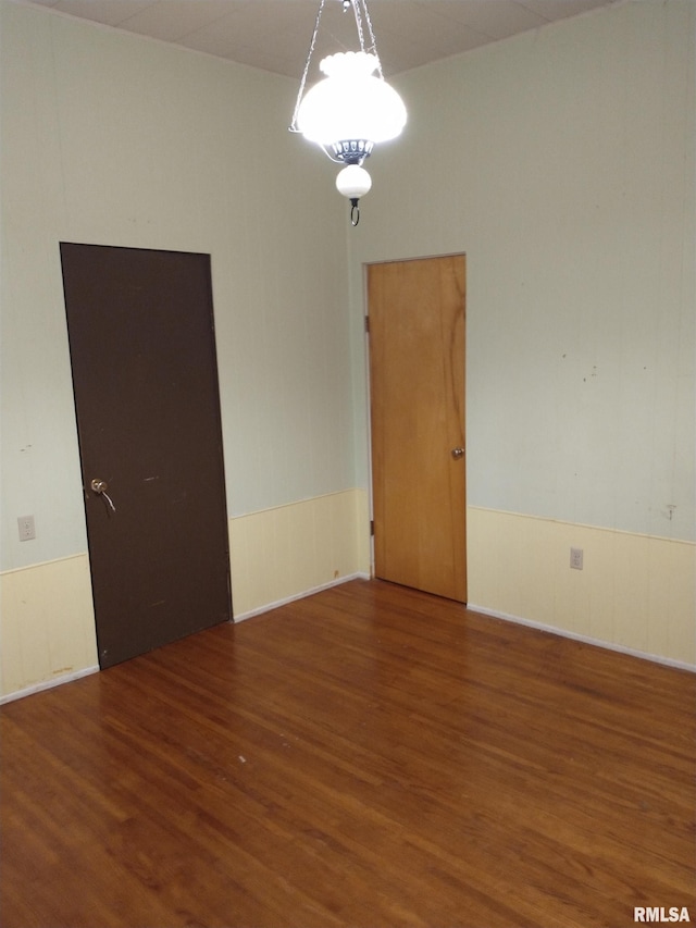 unfurnished room featuring dark hardwood / wood-style floors