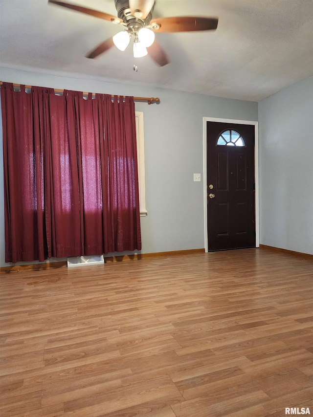 entryway with light hardwood / wood-style flooring and ceiling fan