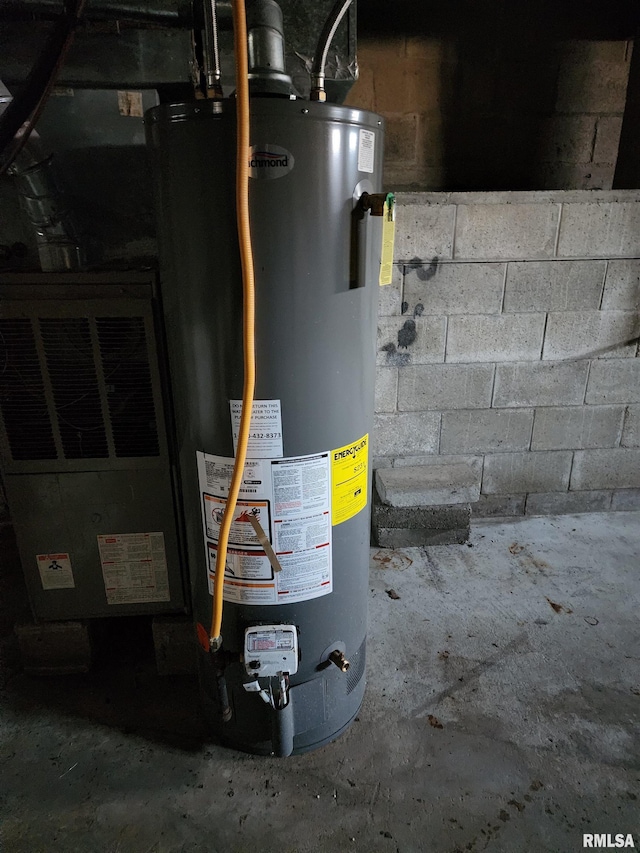 utility room featuring gas water heater