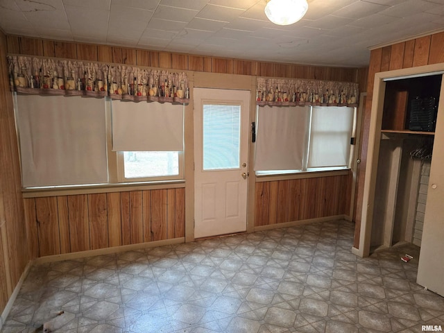 interior space featuring wood walls