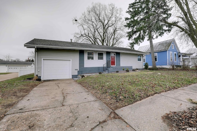 ranch-style house with a front yard and a garage