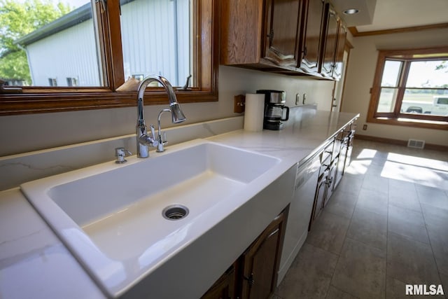 kitchen featuring white dishwasher and sink