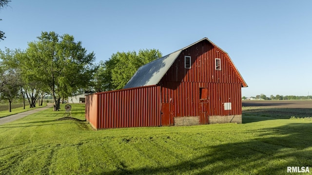 view of outbuilding with a lawn