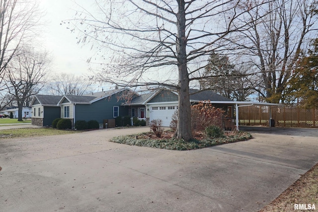 view of front facade with a garage and a carport