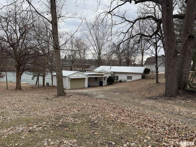 view of front of home featuring metal roof and an attached garage