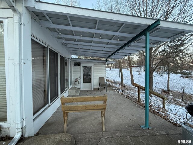 yard covered in snow featuring an outdoor structure