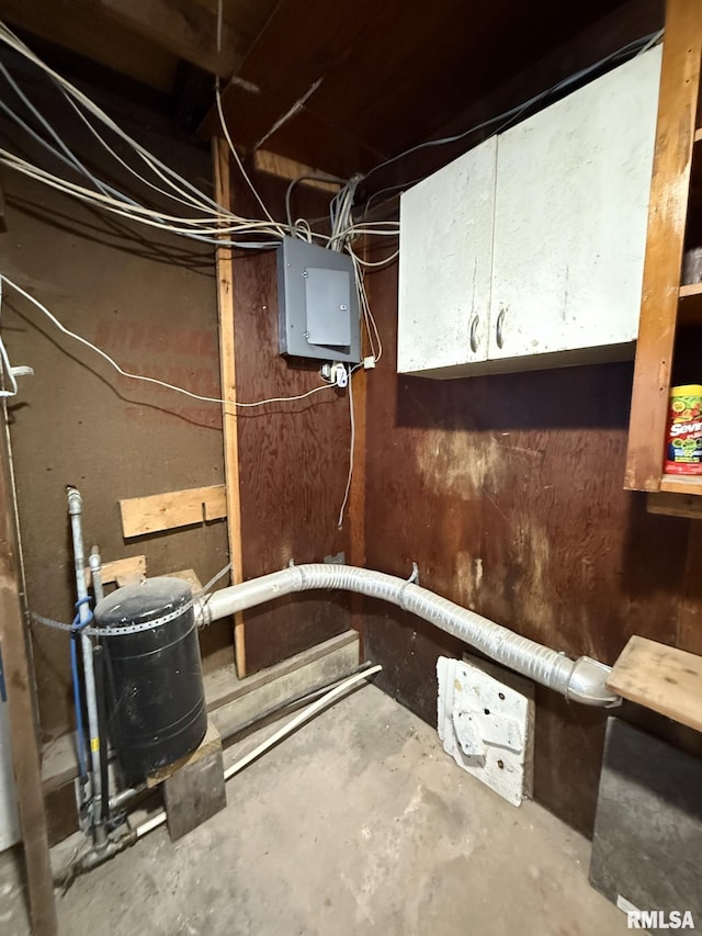 unfinished basement featuring electric panel