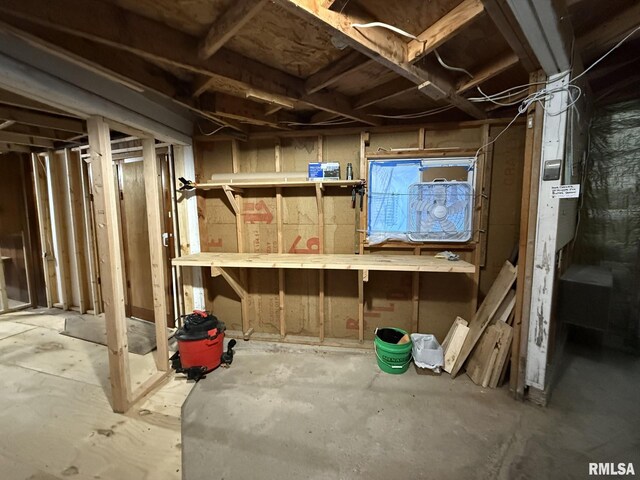 garage featuring a workshop area and a garage door opener