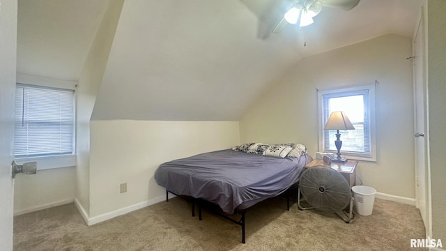 carpeted bedroom with lofted ceiling and ceiling fan