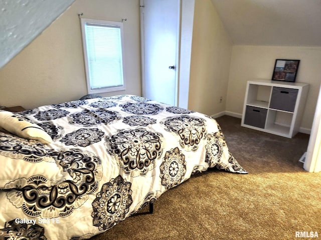 carpeted bedroom with vaulted ceiling