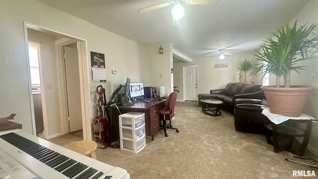 office space featuring light colored carpet and ceiling fan