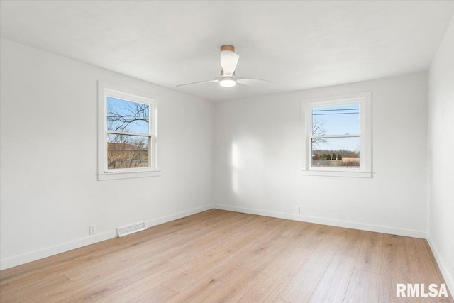 unfurnished room featuring ceiling fan and light wood-type flooring