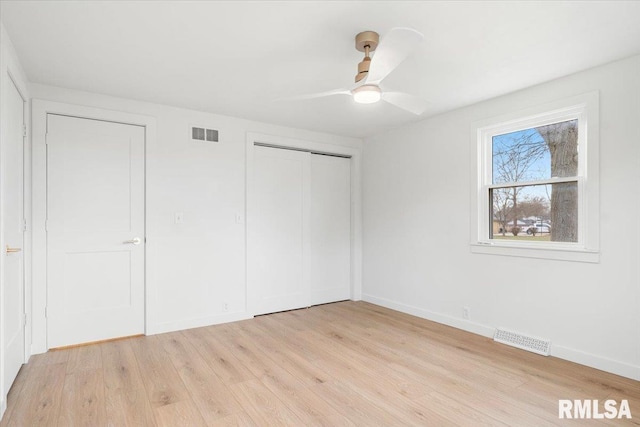 unfurnished bedroom featuring light hardwood / wood-style flooring and ceiling fan