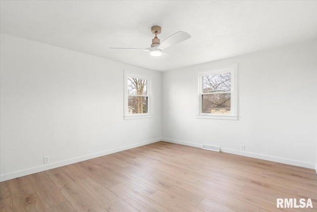 empty room with light wood-type flooring and ceiling fan