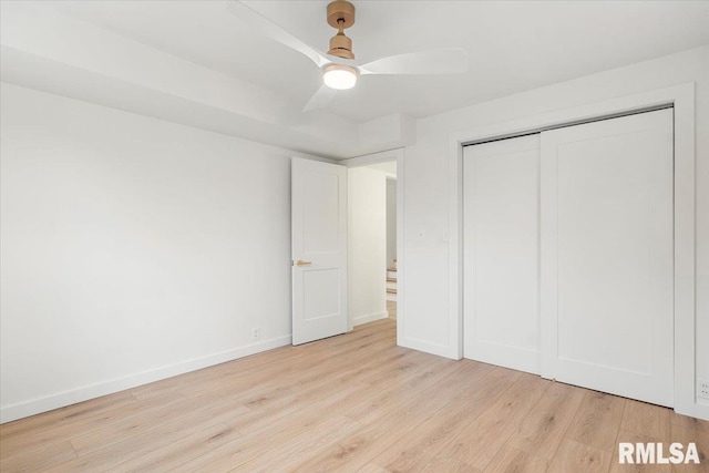 unfurnished bedroom featuring a closet, ceiling fan, and light hardwood / wood-style floors