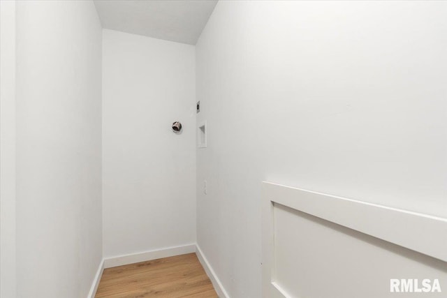 laundry room featuring hardwood / wood-style flooring and hookup for an electric dryer