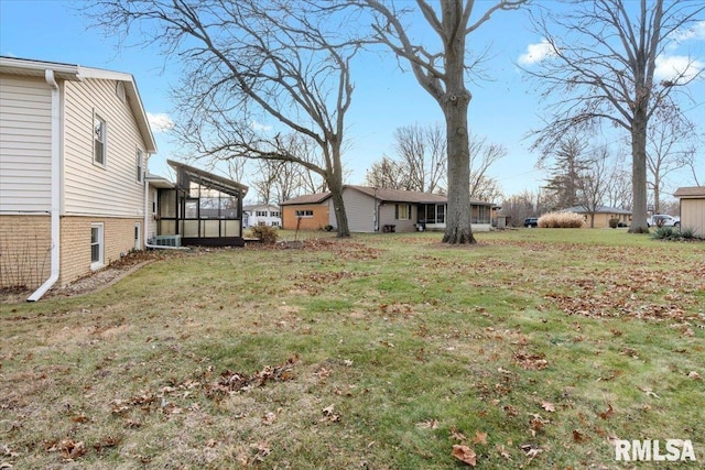 view of yard with a sunroom