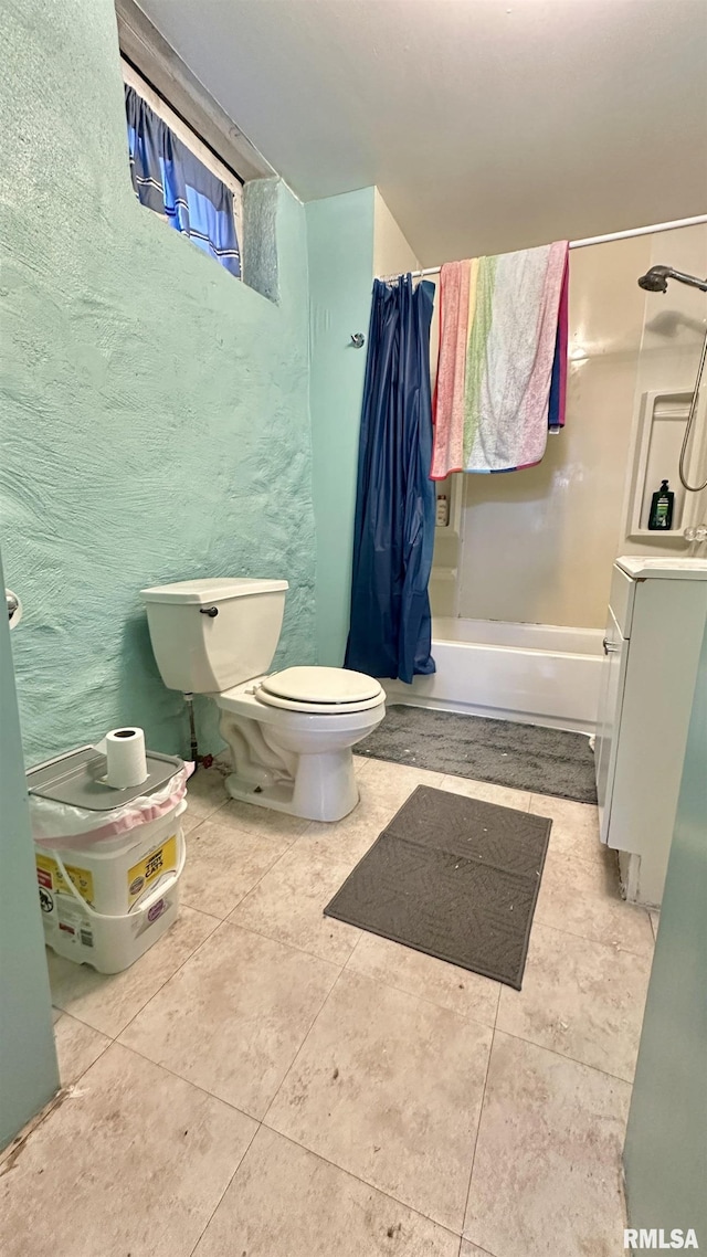 full bathroom featuring toilet, vanity, shower / tub combo with curtain, and tile patterned flooring