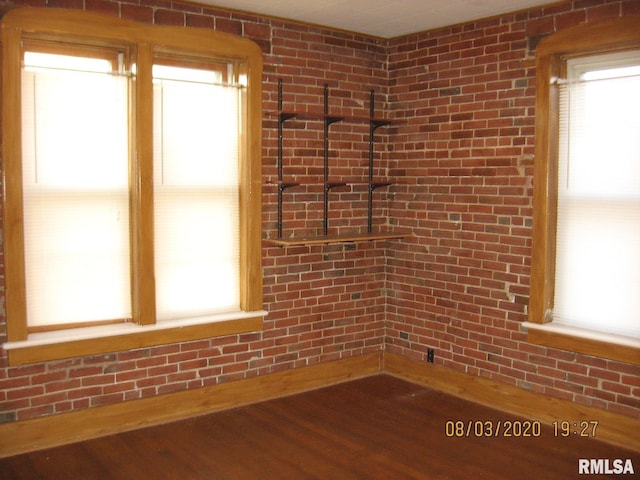 empty room with hardwood / wood-style flooring