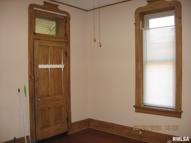 entryway with dark hardwood / wood-style flooring