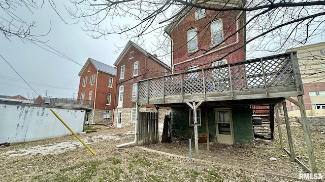 back of property featuring a deck